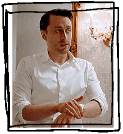 A gif of Roman Roy from succession wiping his hands on his arms.